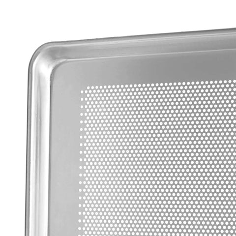 Close-up of the corner of a perforated aluminum sheet pan, showcasing reinforced edge and perforations for airflow.