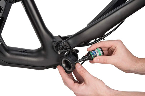 Applying press fit retaining compound for bikes fills gaps and secures press fit bottom brackets and sealed bearings on clean dry surfaces.