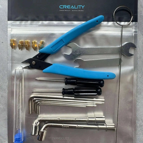 Ender Series 3D Printer Tool Kit featuring clog poke, shear pliers, Allen wrench, cleaning needles, nozzles, and screwdriver