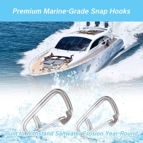 Close-up of two stainless steel marine carabiner snap hooks in foreground with a yacht at sea in the background