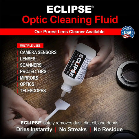 Person using 15ml dropper of Optic Cleaning Solution for Camera Lenses and Sensors on lens