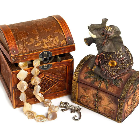 Two antique wooden jewelry boxes with ornate designs, one open showing a pearl necklace, featuring retro bronze box hinges and latches.