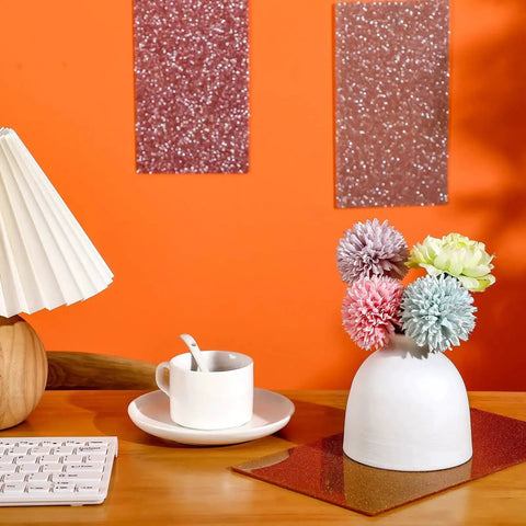Glitter Acrylic Sheets Set for DIY Crafts and Laser Cutting, 3 pieces, colorful glitter finish, displayed on an orange wall with decor items.
