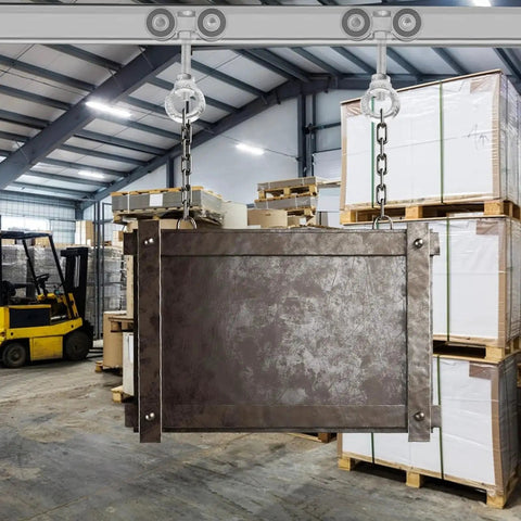 Four Wheel Trolley Assembly Rollers For One And Five Eighths Inch Wide Strut Channel installed, lifting metal structure in warehouse