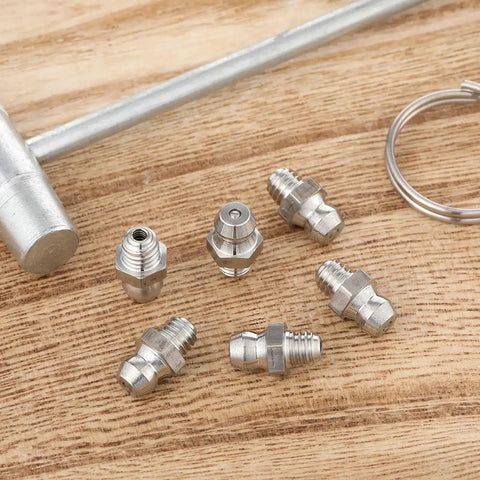 Six Pack Stainless Steel M6 X 1mm Straight Grease Fittings Zerk Nipples For Hydraulic Gear And Machinery on wooden surface