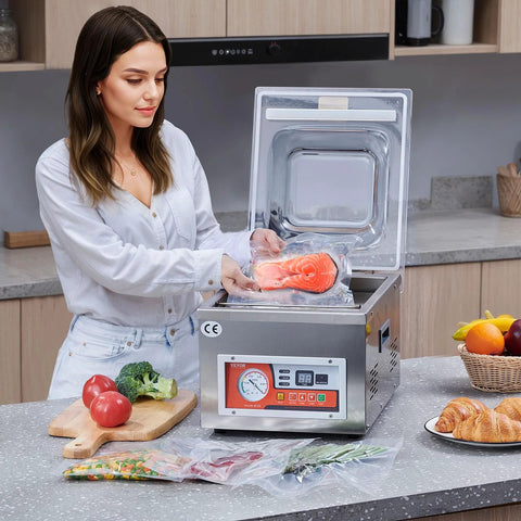VEVOR chamber vacuum sealer on a kitchen counter sealing a salmon fillet in a bag (260W)