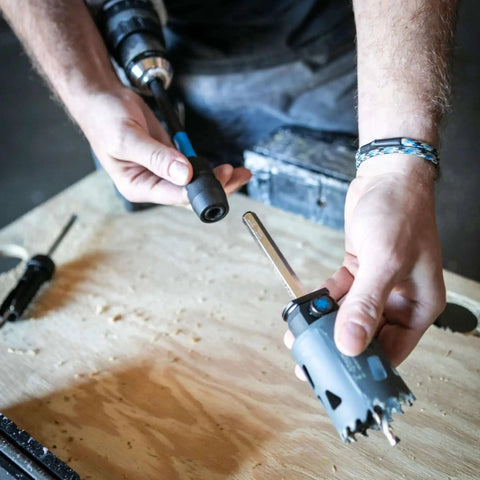 Person assembling 12 Inch Dual Hex Eight And Hex Ten Locking Hole Saw Extension Chuck For Power Drills, Spin On Mount.