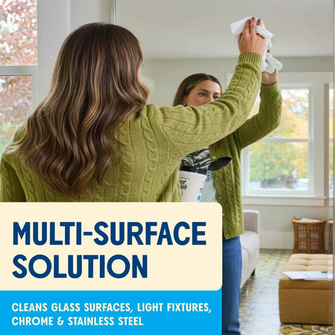 Woman using Streak Free Glass And Window Cleaning Wipes With Vinegar Plant Based Cleaners on a mirror