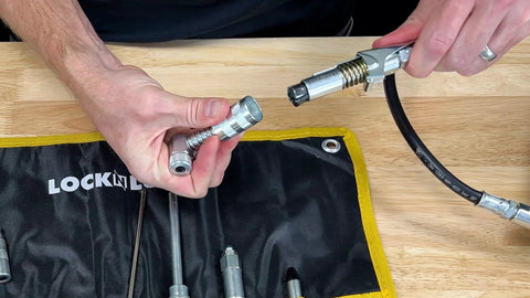 LockNLube 8-Piece Quick-Connect Greasing Accessory Kit with metal fittings and hose in rip-stop case