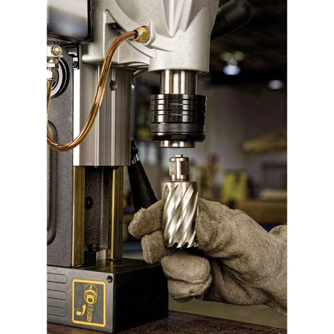 Gloved hand installing bit in Magnetic Drill Press With 2 Inch Capacity And 4 Inch Travel 10 Amp Motor Quick Change Chuck 2 Speed Settings