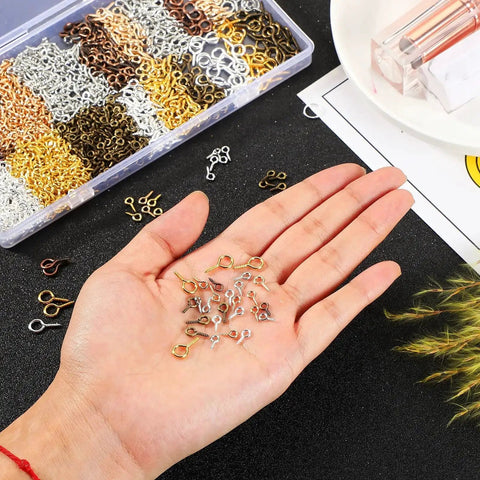 Hand holding mini screw eye pins from 600 Pieces Screw Eye Pins Hooks Set In 6 Colors And 3 Sizes 4x8mm 5x10mm 6x13mm Metal Eyelets