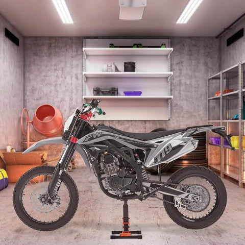 Heavy Duty Dirt Bike Lift Stand With 440 Lb Capacity And Hydraulic Lift holding a dirt bike in a garage setting