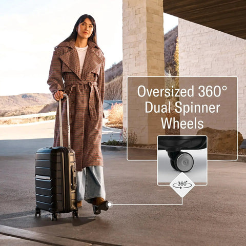 Woman traveling with Freeform Hardside Carry On Luggage With Spinner Wheels By Samsonite, featuring oversized spinner wheels.