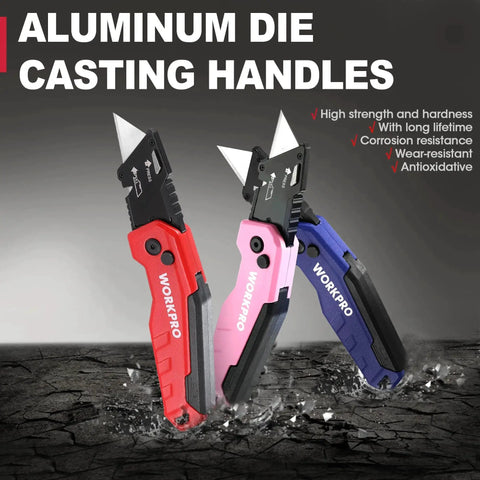 Three folding utility knives with quick change blades, aluminum die-cast handles in red, pink, and blue, standing on a cracked surface.