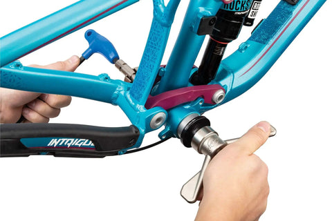 Using Bottom Bracket Bearing Press Set with Quick Release for fast installation on bike, includes machined bushings for 68mm to 150mm widths.