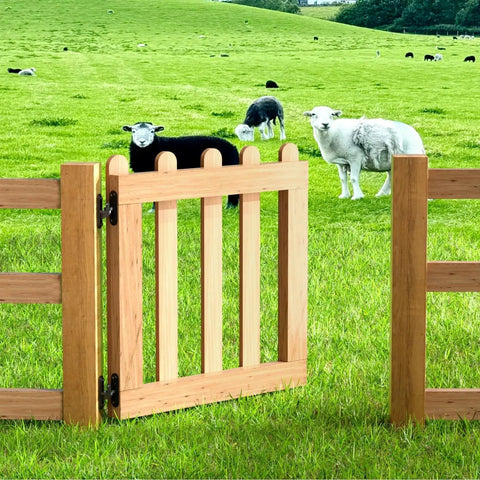 Wooden farm gate with Heavy Duty Gate Hinges Set 2 Pack With 600 Lb Capacity Wall Mount Steel Rust Proof Hardware For Farm Fences And Driveway Gates Anti Sag Design For Wood Or Concrete Posts Weather Resistant Steel Construction With Easy Install And Durable Outdoor Use, in a pasture.