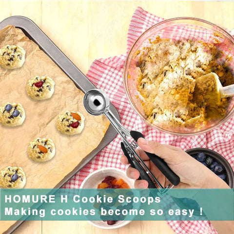 Two Tablespoon Cookie Dough Scoop For Baking Size 40 next to cookie tray and bowl, spring loaded mechanism