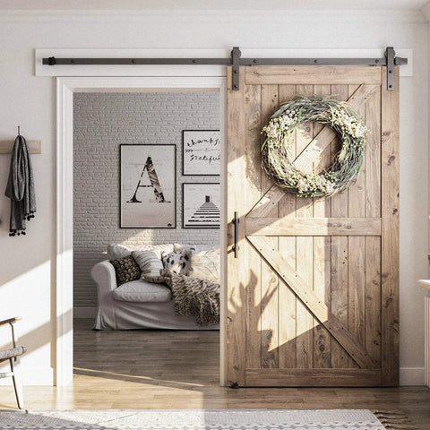 Eight Point Two Foot Sliding Barn Door Hardware Kit With Smooth Quiet Track Easy To Install Includes Step By Step Installation Instructions Fits Forty Eight Inch Wide Door Panel J Shape Hanger Beefy Alloy Construction With Black Powder Coat shown in a cozy living room scene.