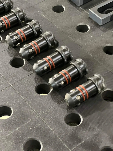 Five Eighths Inch Quick Release Ball Lock Pins For Modular Welding Fixture Tables Two Pack Built Tough And Heavy Duty Solid Steel Positioning Accessories For Fast Easy Setup And Quick Removal shown installed on table
