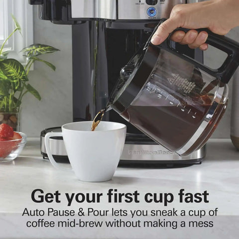 Pouring coffee from 2 Way Programmable Coffee Maker With Single Serve And 12 Cup Glass Carafe Black With Stainless Steel Accents