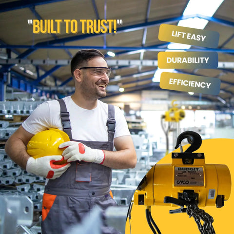 Worker in a factory holding a helmet next to a Half Ton Pneumatic Air Hoist With 20 Foot Lift And Pendant Throttle Control