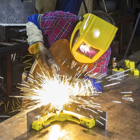 Welder using Pivot Angle 200 Adjustable Welding Magnet For Metal Fabrication And Welding Projects, sparks visible