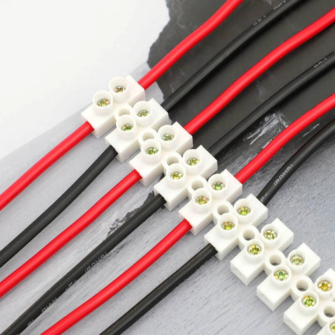 7 Piece 12 Position Dual Row Terminal Block Set for Electrical Wiring 10A 380V Barrier Strip Connector in use with red and black wires