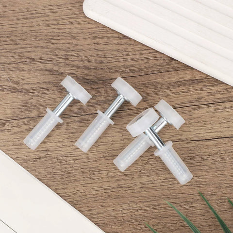 Four Pack Bi Fold Door Top Roller Guide Wheel And Pivot Kit With Seven Eighths Inch Spring Loaded Top Pivots on wood surface