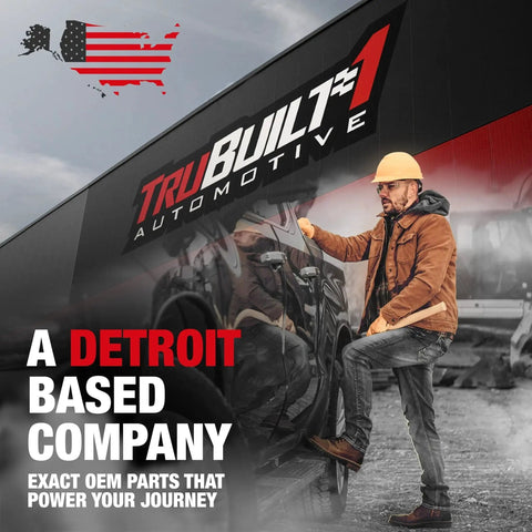 Man in hard hat standing by TruBuilt Automotive building with Detroit-based company sign.