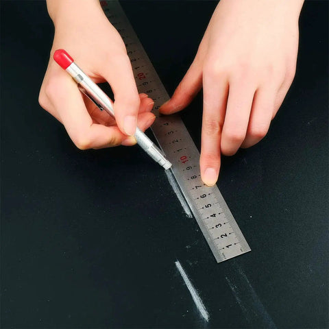 Person using Two Pro Grade Soapstone Marker Pencil Sets With 12 Refills For Welding, Metalworking And Fabrication on metal surface