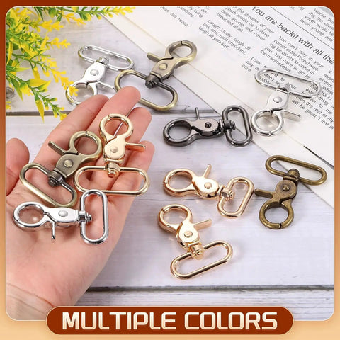 Hand holding Six Pack 25mm Swivel Snap Hooks Heavy Duty Zinc Alloy Clasps For Straps Bags in multiple colors on a table.