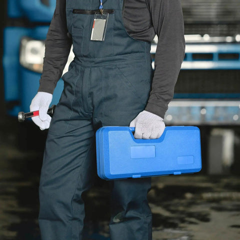 Person carrying blue case with Pro Grade Knockout Hole Punch Set From Half Inch To Two Inch in industrial setting