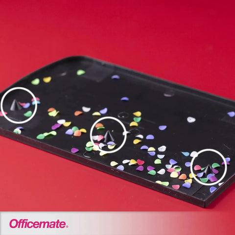 Confetti tray showing colorful paper circles from 3 Hole Punch for Home Office, Medium Duty, 30 Sheet Capacity, Black, Metal Base