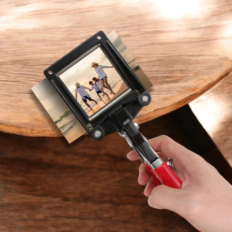 Go-To 50X50Mm Square Photo Cutter Handheld Die Punch Tool being used on a photo for crafting projects, ergonomic red handle