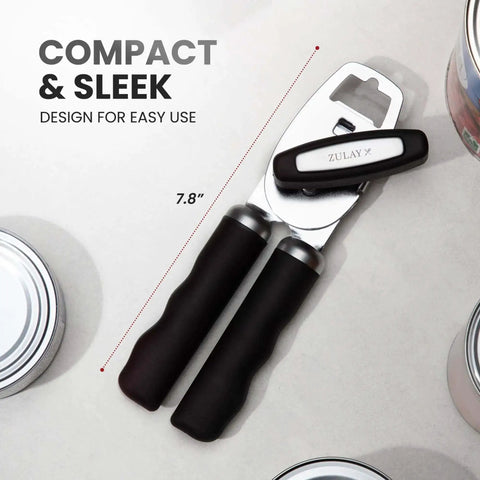 Comfy Manual Can Opener With Bottle Opener, Rust Proof Stainless Steel, Turn Knob, Soft Grip Handles, black kitchen tool on table