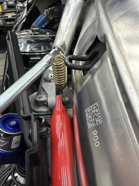 Exhaust Spring Removal Tool For Snowmobiles And Motorcycles Pull Push Twist in use on engine exhaust spring