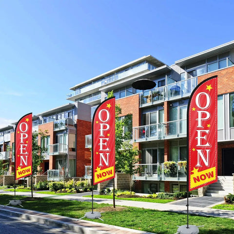 Now Open Feather Flag Pole Kit With Ground Stake Water Bag And Travel Bag Portable Outdoor Advertising Flag Banner displayed outside buildings