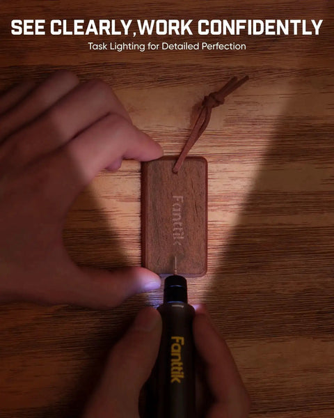 Person using Cordless Engraving Pen Kit With 5 Variable Speeds, Pro Grade Rechargeable Engraver Pen With 20 Bit Set to engrave wooden tag