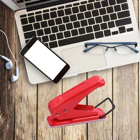One Quarter Inch Hole Puncher With 20 Sheets Capacity Ergonomic Grip Easy Handheld Metal Paper Punch on wooden desk with laptop