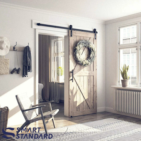 Room with installed 6 Ft Sliding Barn Door Hardware Kit With Track, Pull Handle Set And Floor Guide For 36 Inch Wide Doors