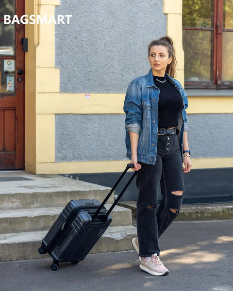 Woman pulling Expandable Carry On Luggage Airline Approved 22x14x9 Inches 35 Liter Capacity Ultra Lightweight Polycarbonate Hard Shell