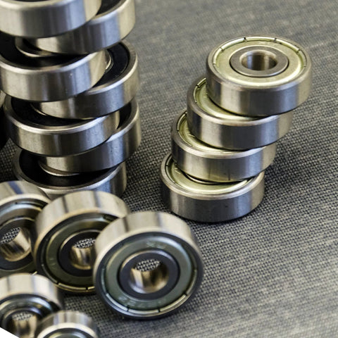 Deep groove ball bearings, 10x22x6 mm, double sealed, carbon steel, 8 pcs, scattered on fabric