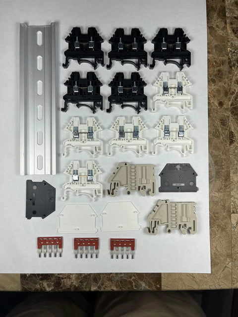 UL Listed AC DIN Rail Terminal Block Kit With Ground Blocks, Jumpers, And End Covers, 20A 600V components displayed.