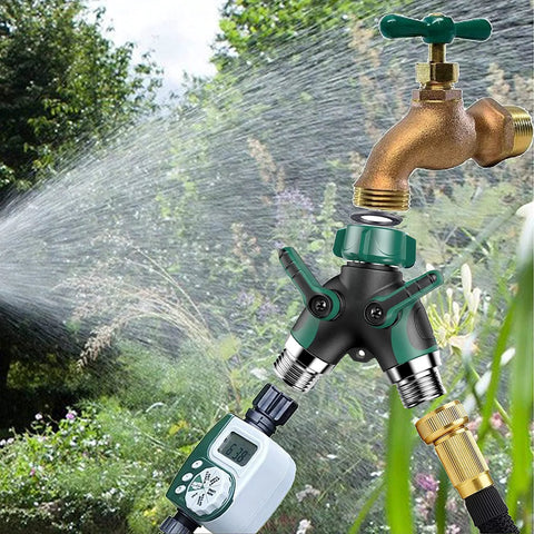 Garden hose splitter 2-way in green/black with dual outlets and levers, attached to brass faucet.