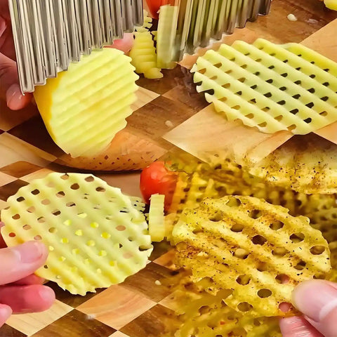 Stainless Steel Crinkle Cutter Wavy Fries Slicer And Vegetable Chopper cutting potatoes into wavy slices, showing ergonomic handle use