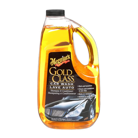 Gold Class Car Wash Shampoo And Conditioner Delivers Pro Results In Foam Cannon Or Bucket Wash While Preserving Wax Protection And A Glossy Finish For All Paint Types 64 Oz Meguiar's in a clear bottle, showing product label and handle.