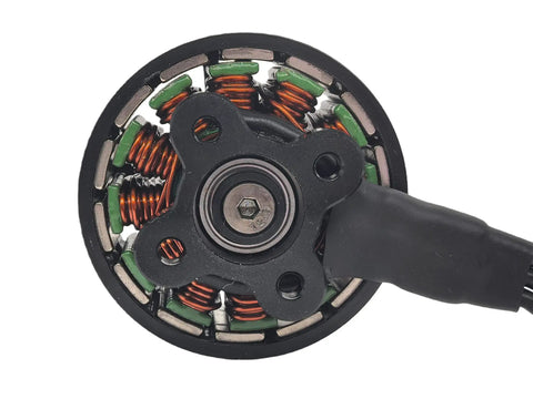 Close-up of 900Kv Brushless Drone Motor for Multirotors with 3 to 6S battery, showing outer rotor three phase design and coils.