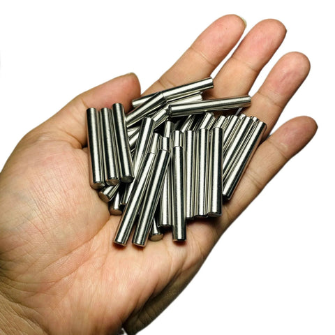 Hand holding 35 Pieces 6mm By 40mm Dowel Pins Set In Stainless Steel 304 For Shelves, Bunk Beds And Wood Projects, M6 Round Pegs