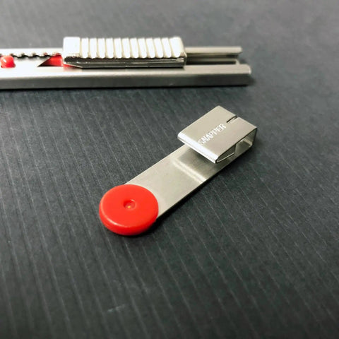Close-up of Auto Lock Stainless Steel Utility Knife With 9mm Blade Built In Snapper Pocket Clip Ambidextrous Tool.
