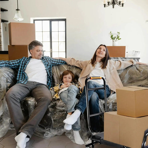 Family relaxing on couch with Folding Hand Truck For Heavy Lifting And Moving Luggage Shopping Office Travel With Four Wheel Rotation